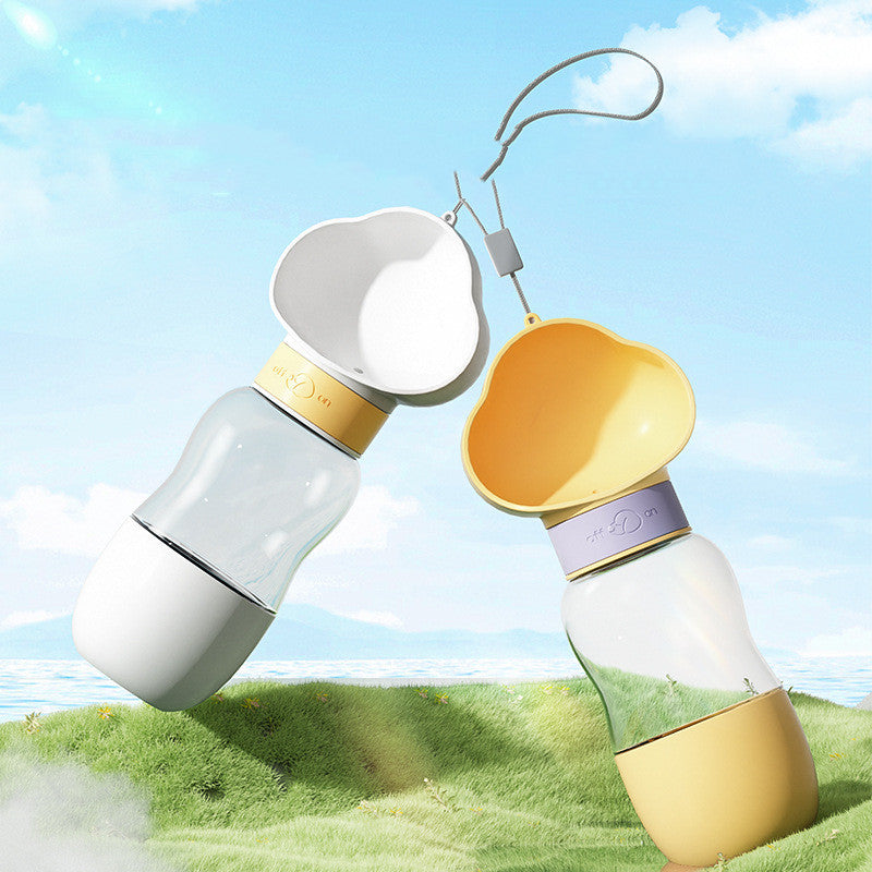 Two colorful bottles with caps on a grassy field with a blue sky-waggloo