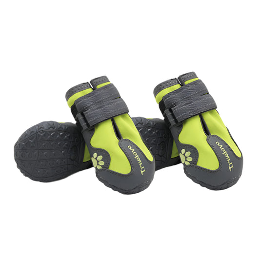 Pair of green and gray pet boots with paw design on a white background