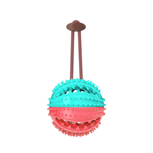 A dog toy featuring a red and blue leaky ball with a suction cup and a red tug-of-war handle, intended for chew and tug play to clean teeth.